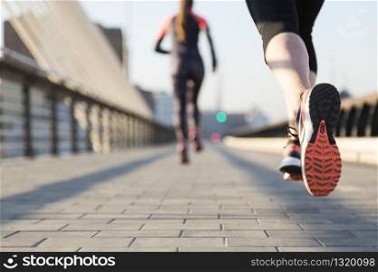 Close-up of woman running with unfocused background