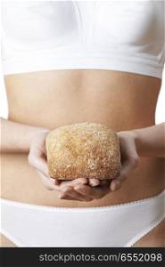 Close Up Of Woman Wearing Underwear Holding Bread Roll