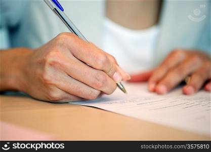 Close-up of woman writing