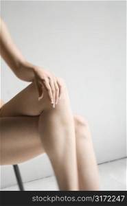 Close-up of womans bare legs.