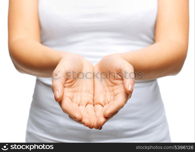 close up of womans cupped hands showing something