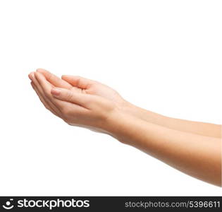 close up of womans cupped hands showing something