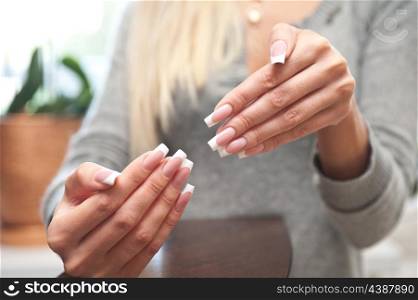 Close-up of womans hand with manicure
