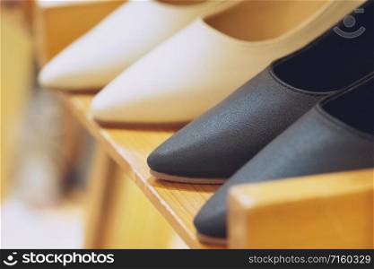 Close up of Women black high heel shoes