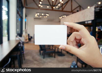 Close up of women hands holding business name card blank copy space screen