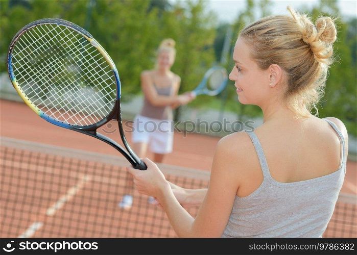 close up of women playing tennis