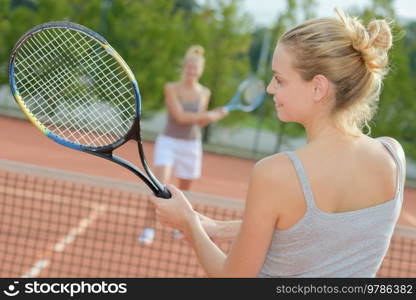 close up of women playing tennis