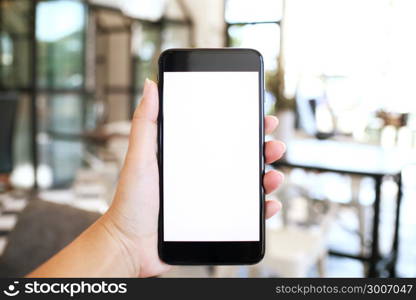 Close up of women&rsquo;s hands holding cell telephone blank copy space screen. smart phone with technology concept.