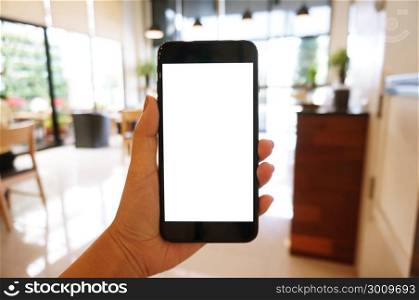 Close up of women&rsquo;s hands holding cell telephone blank copy space screen. smart phone with technology concept.