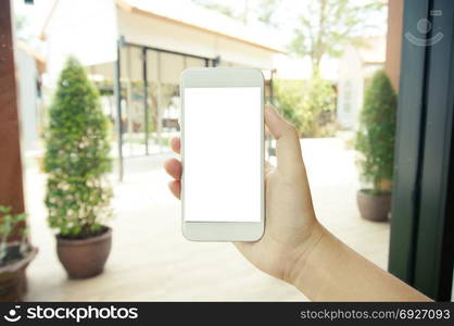 Close up of women&rsquo;s hands holding cell telephone blank copy space screen. smart phone with technology concept