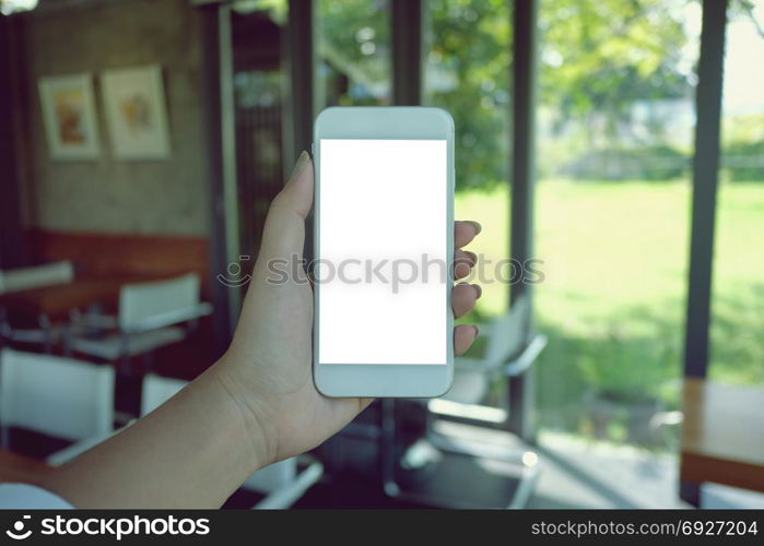 Close up of women&rsquo;s hands holding cell telephone blank copy space screen. smart phone with technology concept