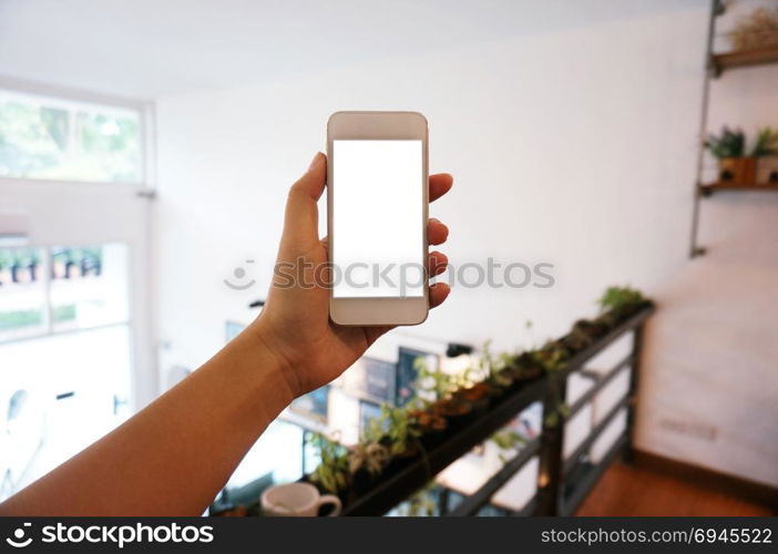Close up of women&rsquo;s hands holding cell telephone blank copy space screen. smart phone with technology concept.