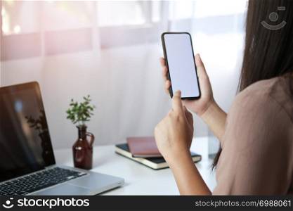 Close up of women&rsquo;s hands holding cell telephone blank copy space screen. smart phone with technology concept