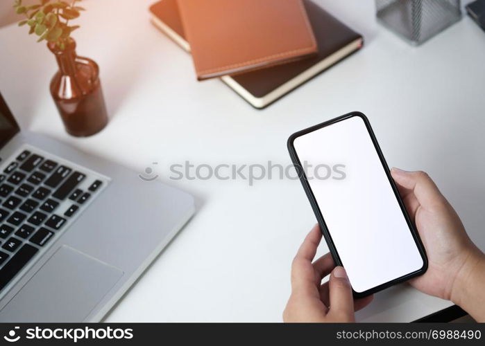 Close up of women&rsquo;s hands holding cell telephone blank copy space screen. smart phone with technology concept