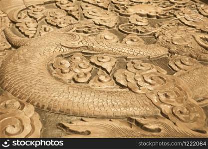 Close up of wood carving of a dragon
