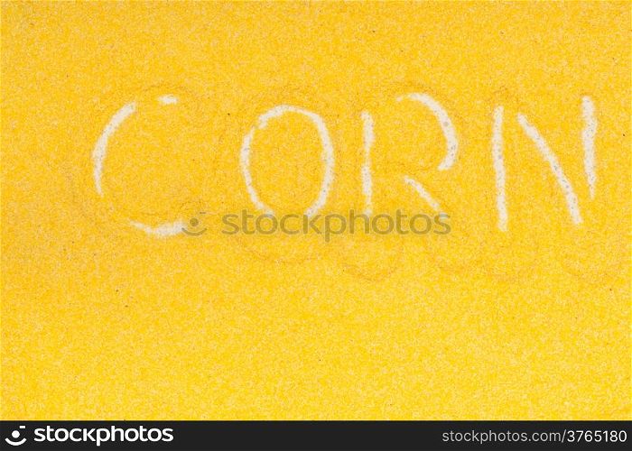 Close up of yellow maize meal with corn sign as food background. Diet and nutrition.