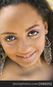 Close-up of young-adult African American woman making eye contact.