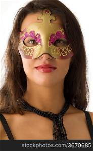close up of young and cute brunette with carnival mask