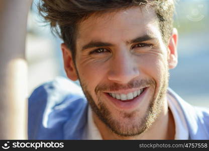 Close-up of young attractive man smiling