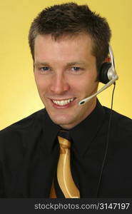 Close-up of young Caucasian male wearing a headset.