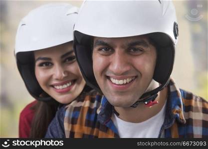 Close up of young couple wearing helmet