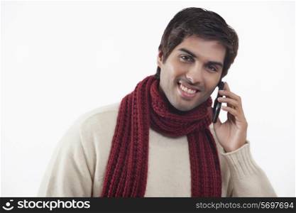 Close-up of young man talking on mobile phone