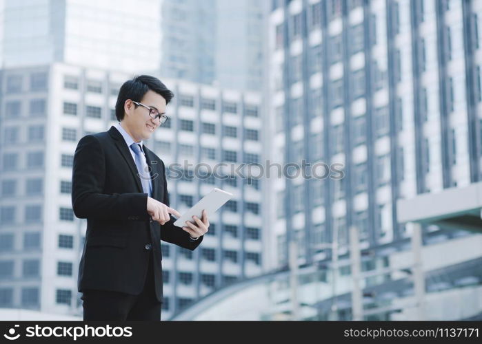 close up of Young Man using tablet. or Business man Contact Customer