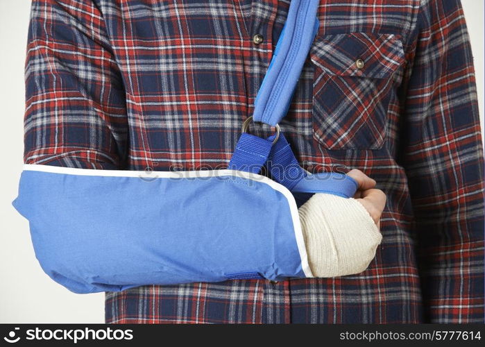 Close Up Of Young Man With Arm In Sling