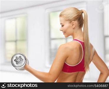 close up of young sporty woman with heavy steel dumbbell