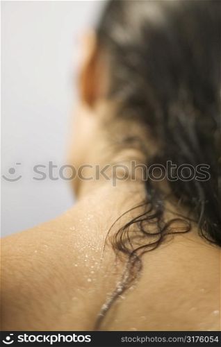 Close up of young woman&acute;s wet neck and hair.