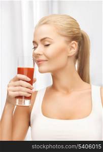 close up of young woman drinking tomato juice