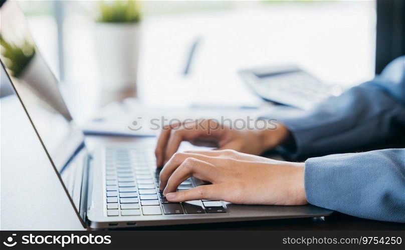 Close up of young woman hands typing on laptop computer keyboard making notes writing on device at cafe coffee shop desk, online, working female text message on computer, business and technology. Close up of young woman hands typing on laptop computer keyboard