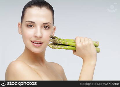 Close-up of young woman holding bamboo shoot