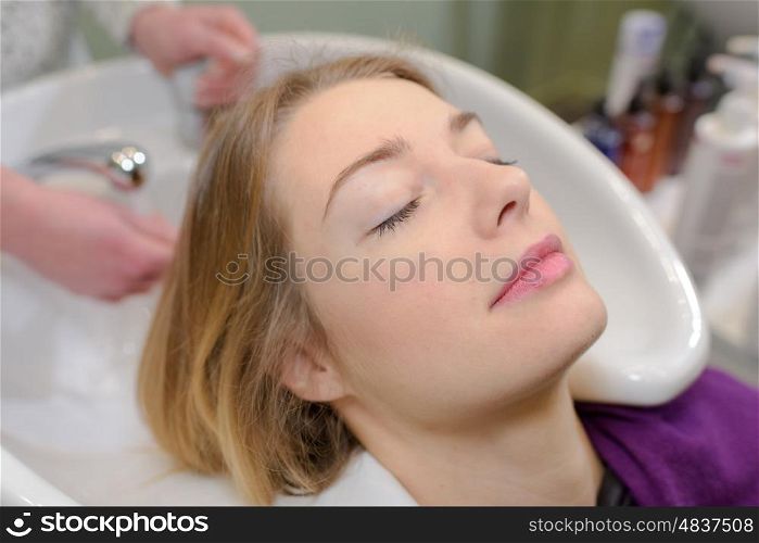 close up of young woman lying with eyes closed