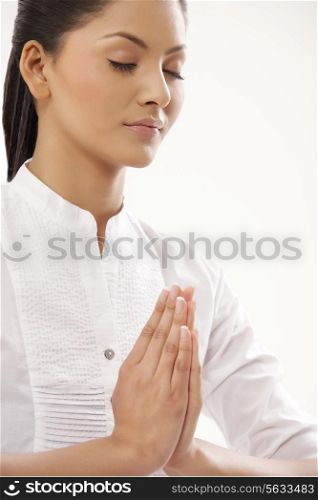 Close-up of young woman meditating