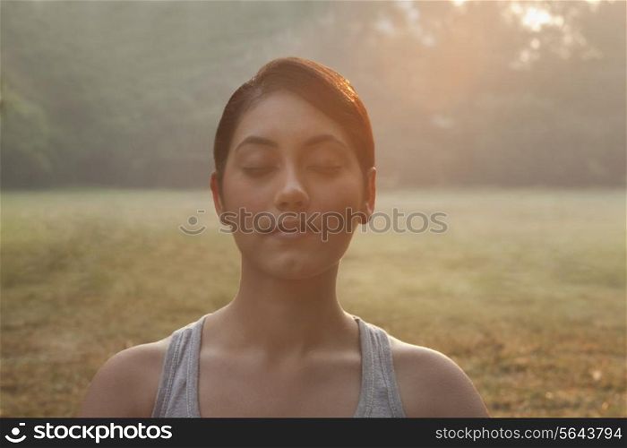 Close-up of young woman meditating