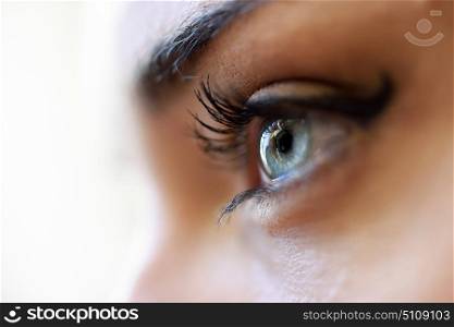 Close-up of young woman&rsquo;s blue eyes with long eyelashes. Make-eye