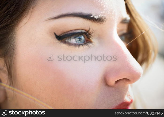 Close-up of young woman&rsquo;s blue eyes with long eyelashes. Make-eye