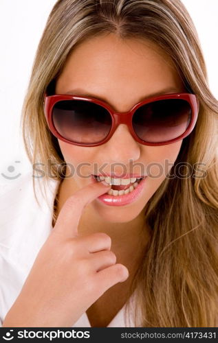 close up of young woman wearing sunglasses on an isolated white background