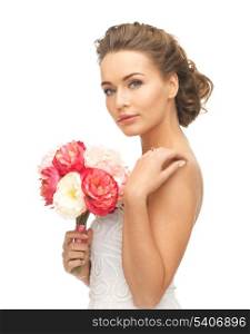 close up of young woman with bouquet of flowers.