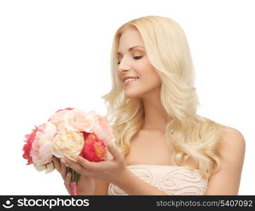 close up of young woman with bouquet of flowers.