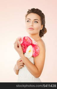 close up of young woman with bouquet of flowers.