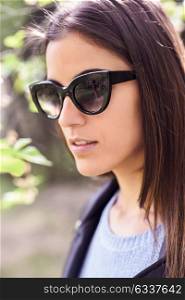 Close-up of young woman with sunglasses