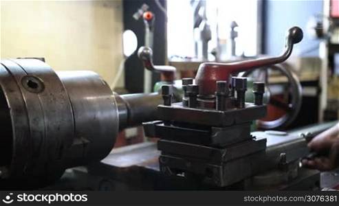 Close up old metal milling machine in workshop