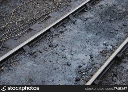 close-up on a antique dirty railway track with ropes