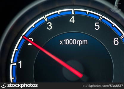 Close up on a tachometer of auto