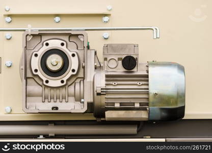 Close up on electric engine in agricultural machine. Industrial details of vehicles concept.. Electric engine in agricultural machine