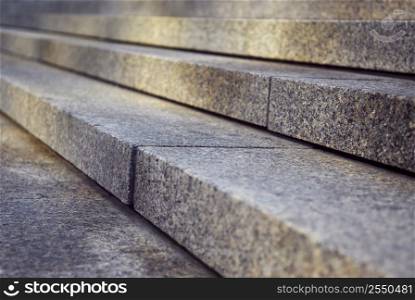 Close up on granite stairs in perspective with sunlight