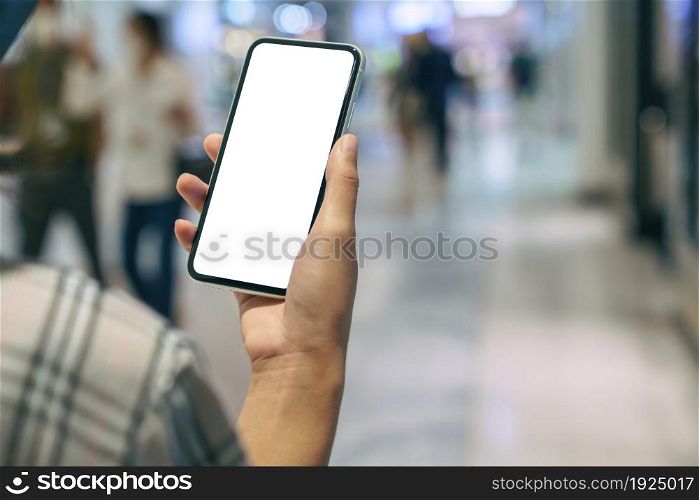 close-up on hand holding phone showing white screen display