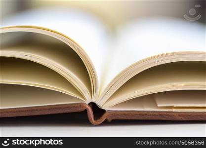 close up on open book pages. the opened book on the table